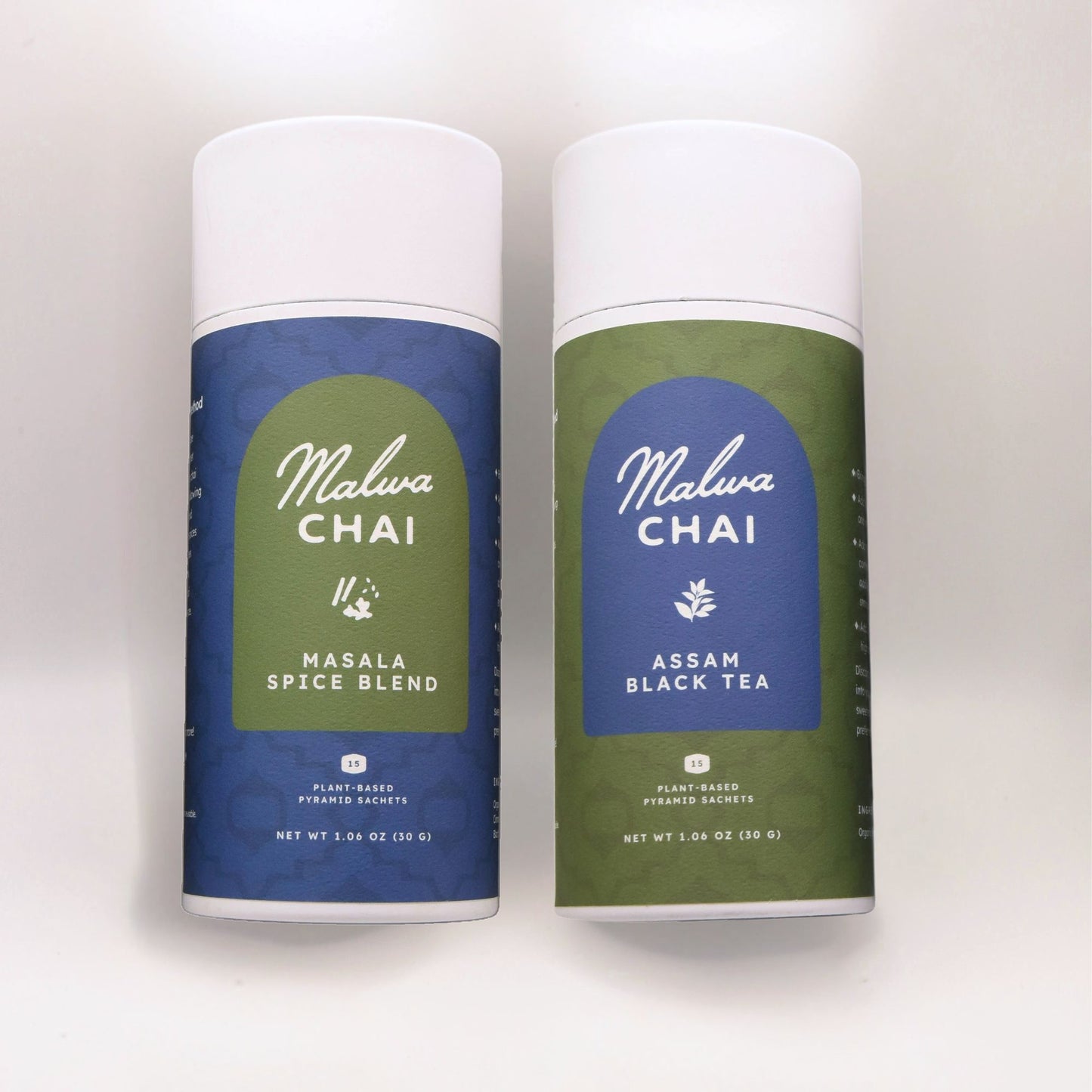Two Malva Chai tea canisters, one for Masala Spice Blend and the other for Assam Black Tea, on a light gray background.