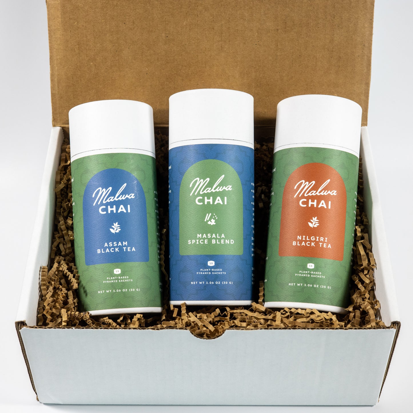 Three Malva Chai tea canisters in a box with different flavors.