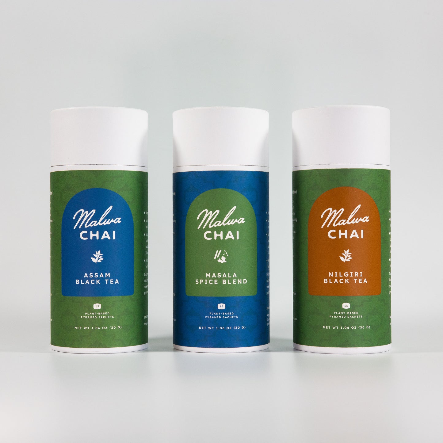 Three cans of Malava Chai tea on a white background